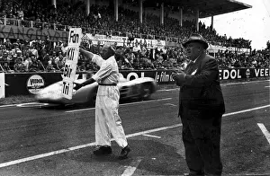 Prints of 17th July 1954: Alfred Neubauer, team manager of Mercedes Benz instructs a mechanic to signal to the two Mercedes during a French Grand Prix at Reims Vintage Car Collection Prints: Racing Jargon