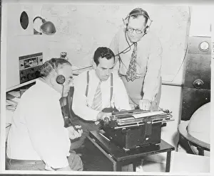 Radio Broadcasters Working on Script at Typewriter