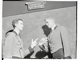 Two Radio City Music Hall Ushers Speaking with Signals