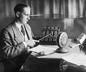 Radio Operator Preparing to Ring an Alarm Bell