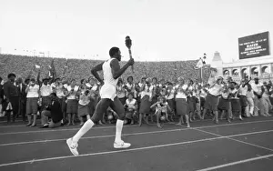Rafer Johnson Carries The Olympic Torch At Opening Ceremony