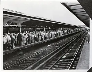 Railroad Commuters Standing On Platform