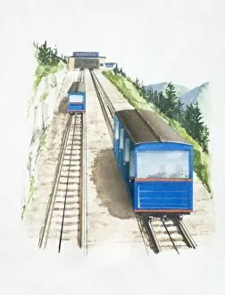 Two railway cars being pulled up a steep slope