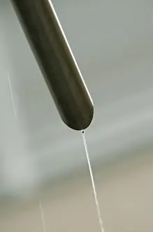 Pipes Prints: Rain water flowing from a drain pipe