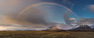 Images Dated 27th October 2013: Rainbow arch over grass field in Iceland