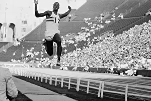 Ralph Boston Performing Record Breaking Jump at Olympics