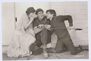 Prints of (Original Caption). Ramon Novarro, Joan Crawford and Ernest Torrence at bay in the mutiny scene in MGM's silent film Across to Singapore A Glamorous Life Captured: Ramon Novarro and Joan Crawford with Ernest Torrence