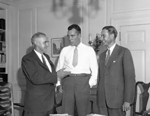 Raymond Moley Conversing with Others