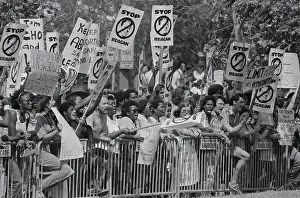 Reagan Protesters Holding up Signs