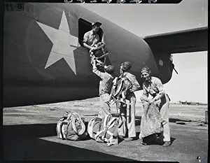 Life Preserver Prints: Rear Gunners Load Flying Equipment