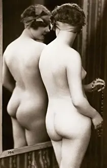 Rear View of Nude Young Woman Standing in Mirror