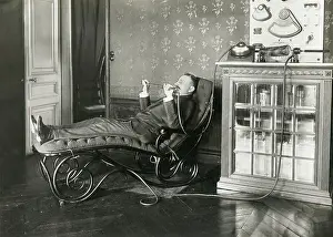 Reclining Prints: Reclining Man Holding Condenser Rod