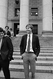 Red Auerbach and Danny Ainge Leaving Court