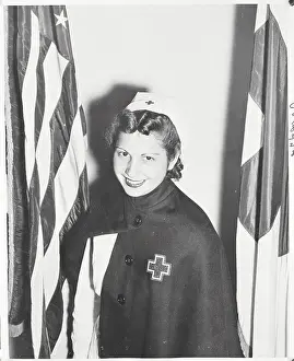 Red Cross Nurse Agnes Rosele Posing by Flags