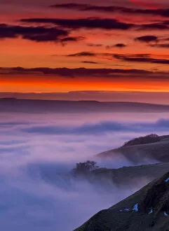 Red Dawn over Peveril Castle in the English Peak District. UK