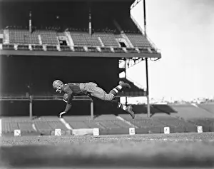 Red Grange Jumping in Air