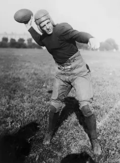 Throwing Prints: Red Grange Posing with a Football