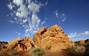 Red sandstone formation with blue cloudy sky in morning light, on the North Shore Road, Valley of Fire, Nevada