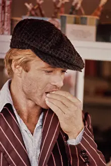 Prints of American actor Robert Redford wearing a striped brown jacket and a grey newsboy cap, the set of The Sting, filmed in the United States, 1973 Robert Redford: Classic Hollywood Elegance: Redford in The Sting