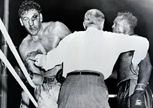 Stopping Prints: Referee Holds Archie Moore off James Parker During Boxing Match