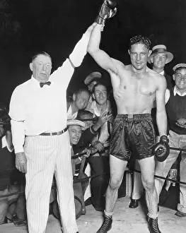 Referee Prints: Referee Holds Max Baer's Hand Up In Victory