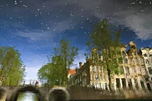 Images Dated 8th May 2011: Reflection of buildings in a canal in Amsterdam, Holland, Netherlands, Europe