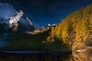 The reflection of snow mountain peak in Yading