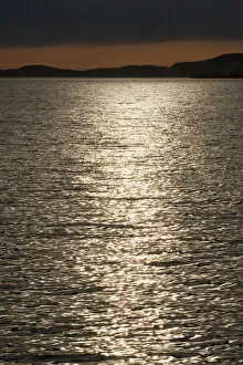 Reflections of the sun at dusk, Rodoyfjorden, Norway, Scandinavia, Europe