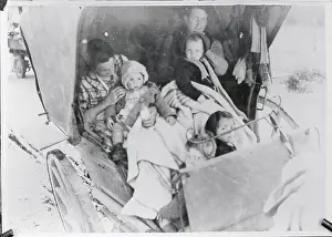 Refugee Vehicle Carrying Parents and Children to Safety