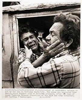 Refugee Woman Embracing Her Son