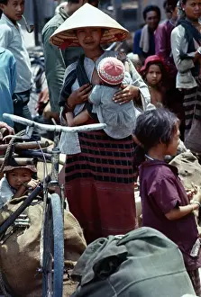 Refugee Woman Holding Her Child