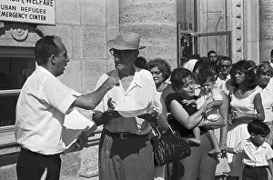Refugees Looking over Forms