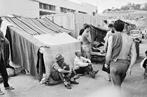 Refugees Waiting by Tents