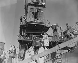 Refugees Walk Down Ramp of Ship