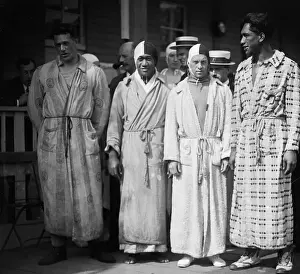 Prints of (Original Caption) 1920, Antwerp, Belgium: Norman Ross, Keahola, McGill and Duke Kahanamoku, the U.S. Olympic Relay Team winners, are shown in robes and swimming caps Capturing Glory: A Journey Through Olympic History: US Relay Swim Team in Robes