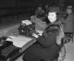 Typing Prints: Reporter Dorothy Killgallen Sitting at Typewriter