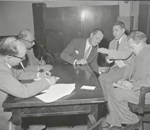 Reporter Lighting Cigarette for Robert Montgomery