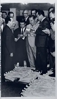 Reporters Standing on Gold Bars in Bags