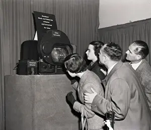 Reporters And Visitors Watch Color Tv