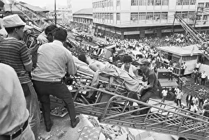 Rescue Prints: Rescuers Carry Quake Victim Down Ladder