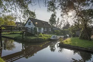 Images Dated 23rd May 2012: Residential Houses, Bridge and Boats In Giethoorn Village