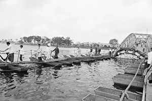 Residents Crossing Damaged Bridge