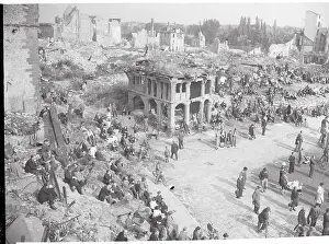Residents Standing Among Ruins