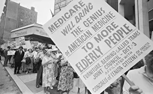 Retired Senior Citizens Carrying Pro-Medicare Signs