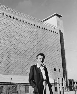 Reuben Hecht Standing in Front of Silo