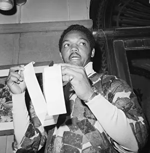 Reverend Jesse Jackson Holding a Receipt