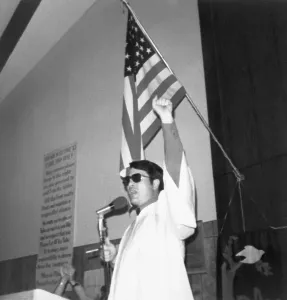 Airline Prints: Reverend Jim Jones Raising His Fist