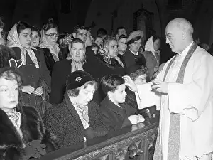 Reverend Placing Ashes On Foreheads