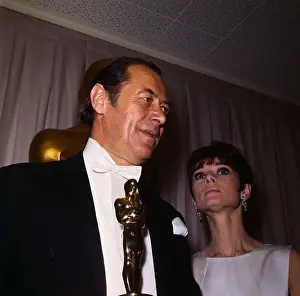 Statuette Prints: Rex Harrison Holding Oscar with Audrey Hepburn