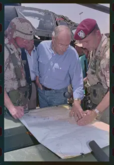 Prints of (Original Caption). Dhahran, Saudi Arabia: Defense Secretary gets briefed-U.S. Secretary of Defense Richard Cheney (C) examines a map during a briefing by Brig Cheney Uncovered: Political Portraits: Richard Cheney Being Briefed by Officers
